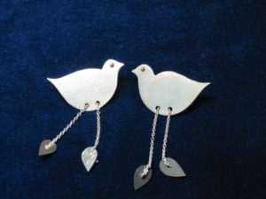 Silver bird brooches